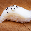 54. Flamberet Hellefisk Nigiri (1 stk)